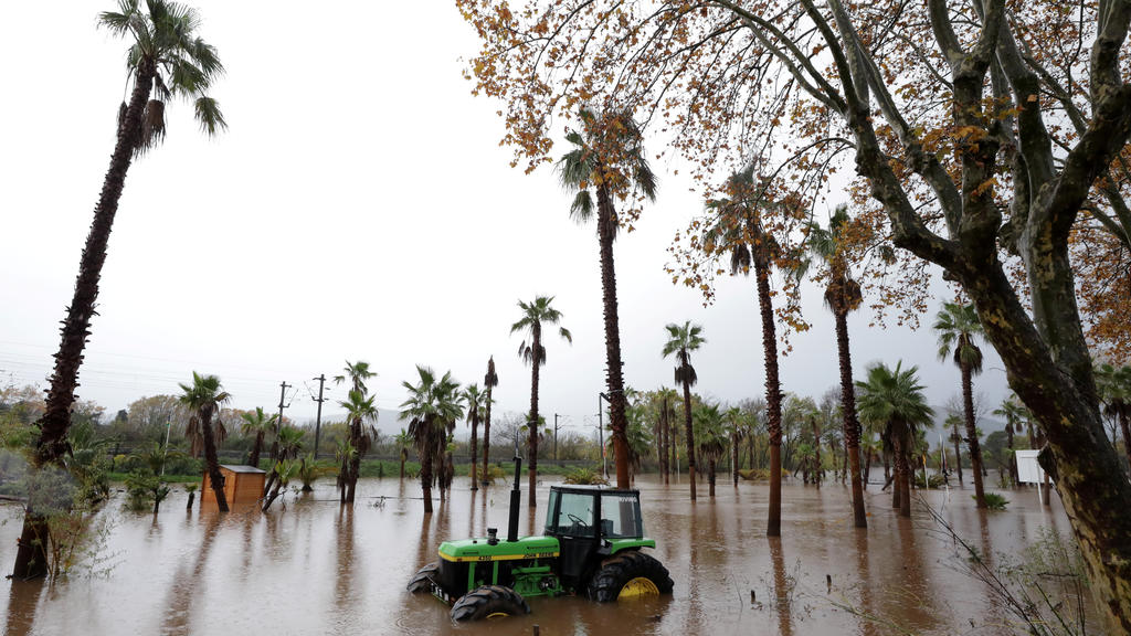 A tractor is seen on a flooded street after heavy rain fall in Roquebrune-sur-Argens, France, November 24, 2019. REUTERS/Eric Gaillard