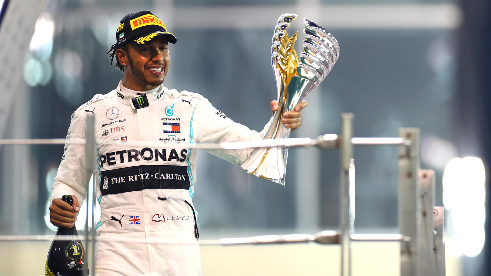 ABU DHABI, UNITED ARAB EMIRATES - DECEMBER 01: Race winner Lewis Hamilton of Great Britain and Mercedes GP celebrates on the podium during the F1 Grand Prix of Abu Dhabi at Yas Marina Circuit on December 01, 2019 in Abu Dhabi, United Arab Emirates. (