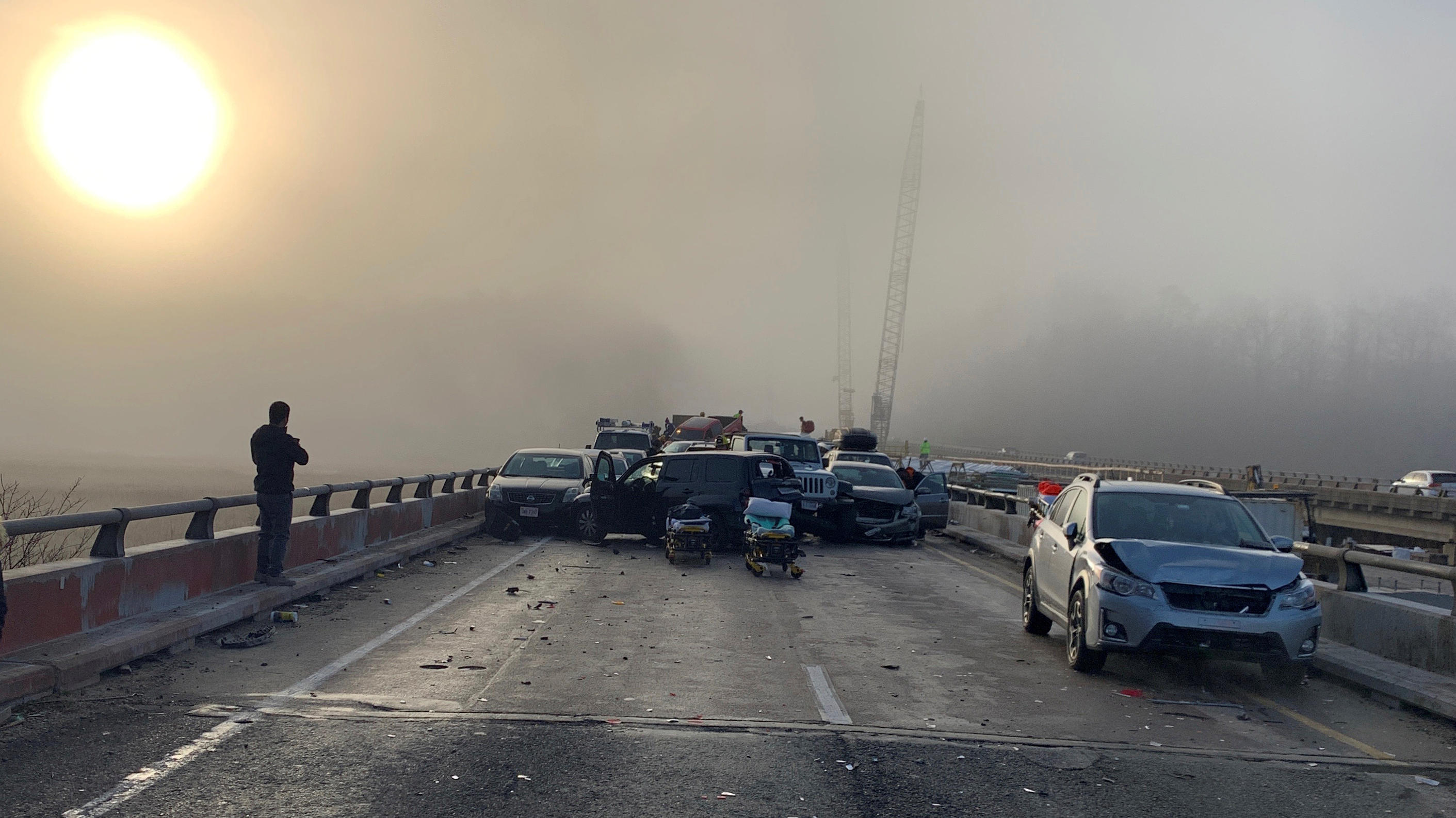 Damaged vehicles are seen after a chain reaction crash on I-64 in York County, Virginia, U.S. December 22, 2019, in this image obtained from social media. Bray Hollowell/via REUTERS THIS IMAGE HAS BEEN SUPPLIED BY A THIRD PARTY. MANDATORY CREDIT.