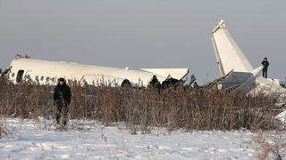 Emergency and security personnel are seen at the site of a plane crash near Almaty, Kazakhstan, December 27, 2019. REUTERS/Pavel Mikheyev