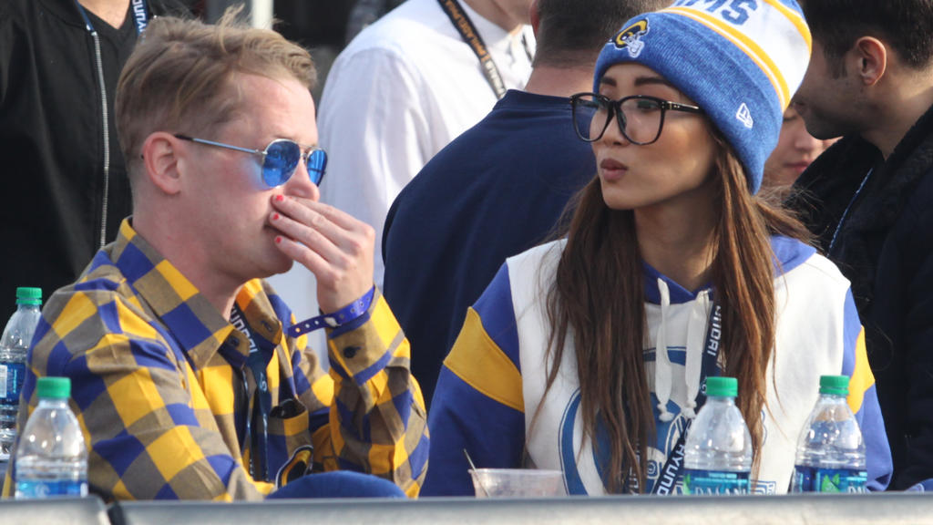 Actor Macaulay Culkin wearing red nail polish and girlfriend Brenda Song attend the game between the Los Angeles Rams and the Arizona Cardinals at the Los Angeles Memorial Coliseum on December 29, 2019 in Los Angeles, CaliforniaPictured: Macaulay Cul