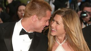 CANNES, FRANCE - MAY 13:  Actor Brad Pitt and wife actress Jennifer Aniston attend the World Premiere of the epic movie 'Troy' at Le Palais de Festival on May 13, 2004 in Cannes, France. Aniston wears a dress by Versace. (Photo by Evan Agostini/Getty Images)