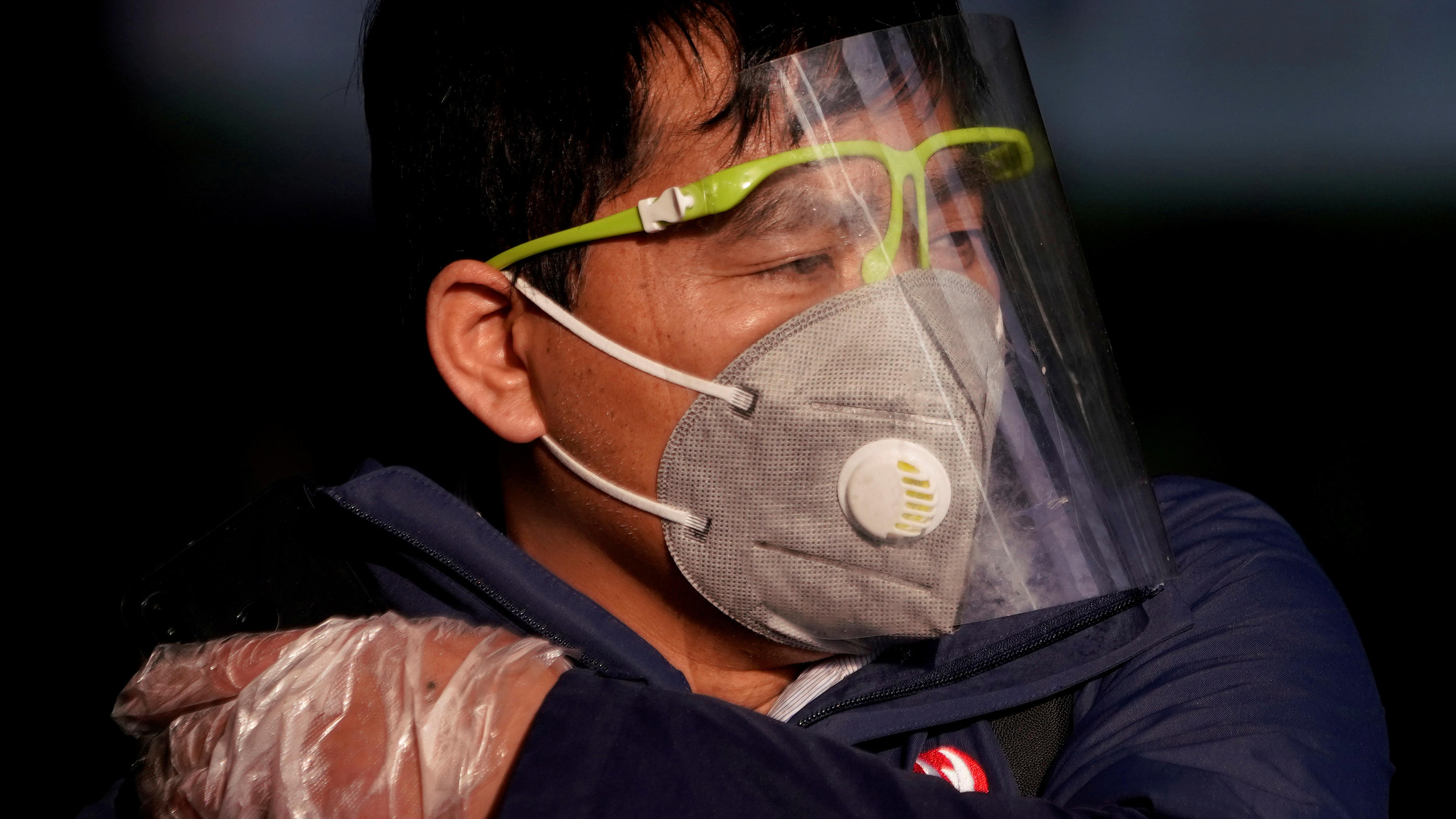 FILE PHOTO: A man wearing a mask is seen at the Shanghai railway station in Shanghai, China, as the country is hit by an outbreak of the novel coronavirus, February 12, 2020. REUTERS/Aly Song/File Photo