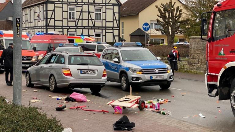 People react at the scene after a car ploughed into a carnival parade injuring several people in Volkmarsen, Germany February 24, 2020. ATTENTION:NUMBER PLATE WAS PIXELATED FROM SOURCE. Elmar Schulten/Waldeckische Landeszeitung via REUTERS.