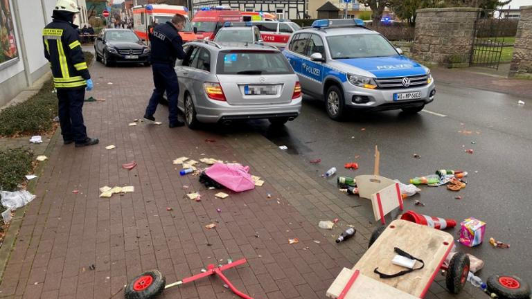 People react at the scene after a car ploughed into a carnival parade injuring several people in Volkmarsen, Germany February 24, 2020. ATTENTION:NUMBER PLATE WAS PIXELATED FROM SOURCE.     Elmar Schulten/Waldeckische Landeszeitung via REUTERS.      