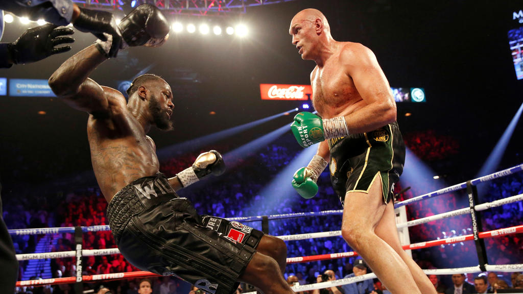 Boxing - Deontay Wilder v Tyson Fury - WBC Heavyweight Title - The Grand Garden Arena at MGM Grand, Las Vegas, United States - February 22, 2020 Tyson Fury knocks down Deontay Wilder during the fight REUTERS/Steve Marcus TPX IMAGES OF THE DAY