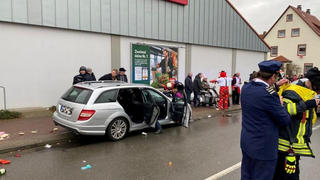 People react at the scene after a car ploughed into a carnival parade injuring several people in Volkmarsen, Germany February 24, 2020. ATTENTION:NUMBER PLATE WAS PIXELATED FROM SOURCE.     Elmar Schulten/Waldeckische Landeszeitung via REUTERS.
