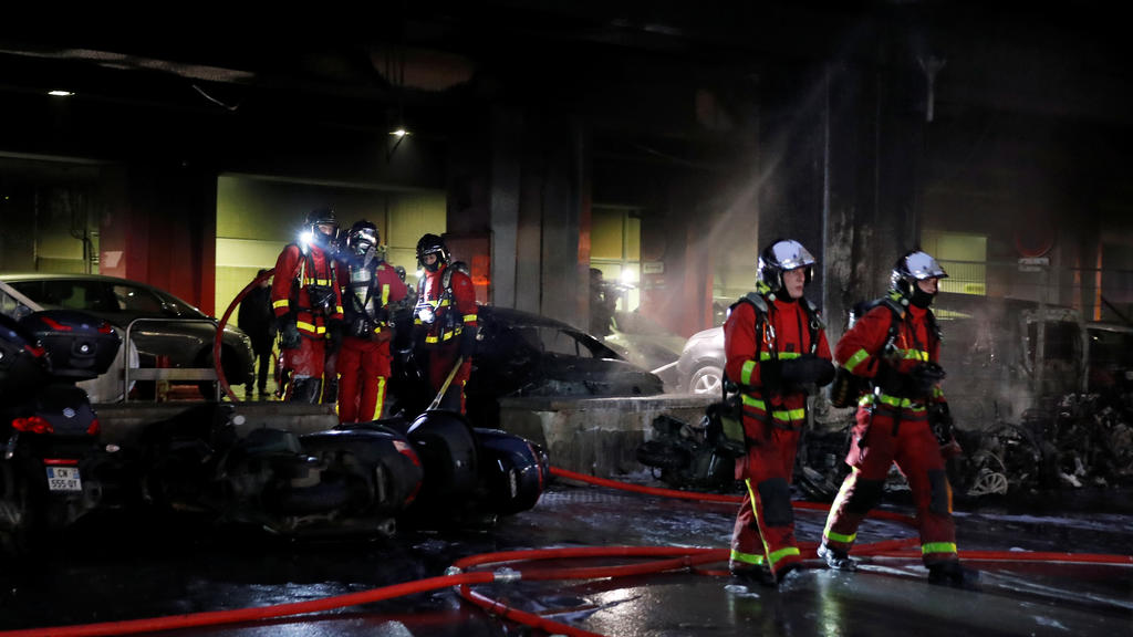 Fire fighters work at the scene of a fire near Gare de Lyon railway station in Paris, France, February 28, 2020. REUTERS/Gonzalo Fuentes