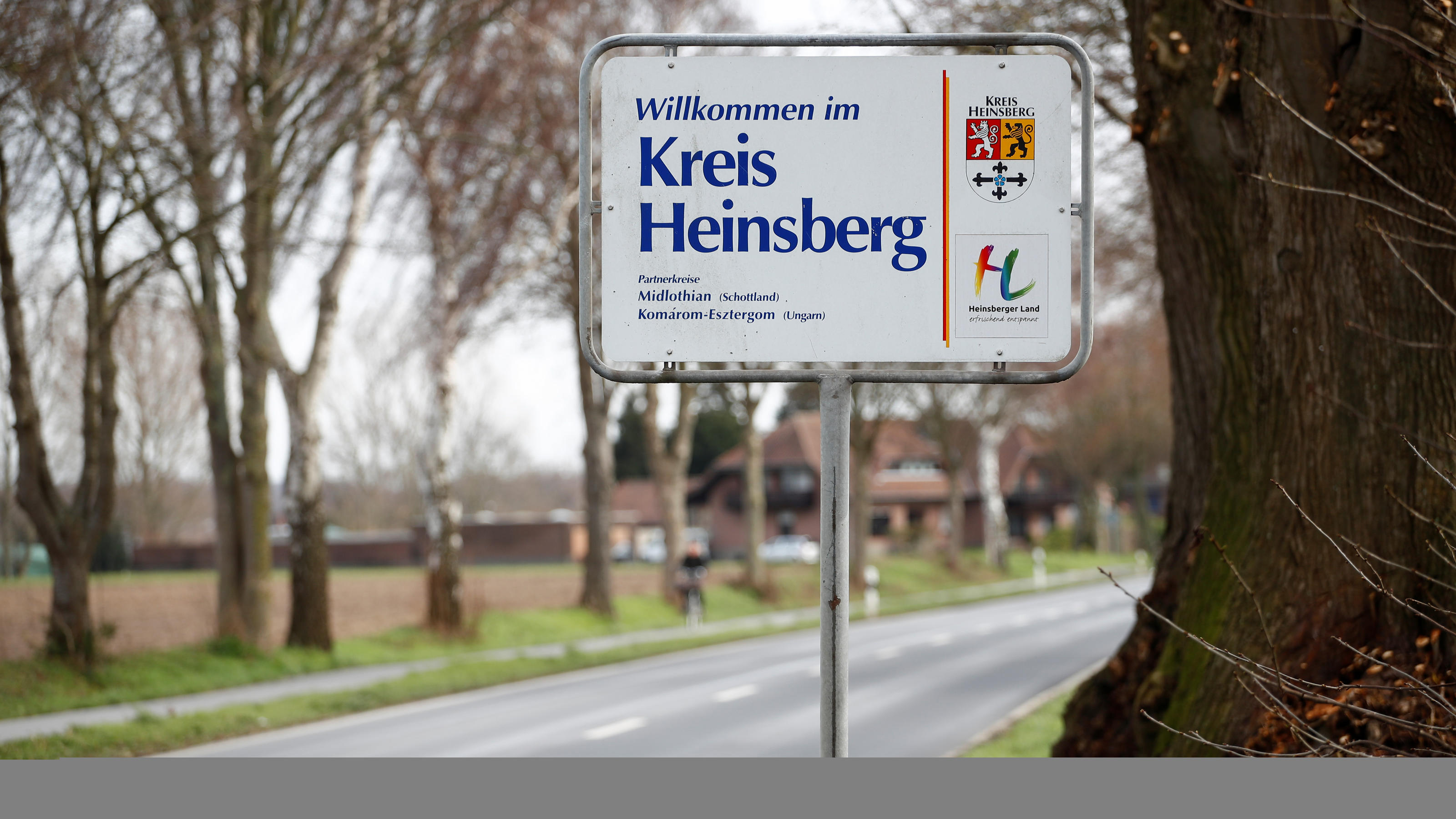 A sign reading "Welcome to the Heinsberg county" is pictured in the western German administrative district of Heinsberg, following the new coronavirus cases confirmed in the region, near Gangelt, Germany, February 28, 2020. REUTERS/Wolfgang Rattay