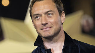 FILE - In this Feb. 27, 2019 file photo, actor Jude Law poses for photographers upon arrival at the premiere of the film 'Captain Marvel', in London. Law is among the readers in an all-star recording of J.K. Rowling's â€œThe Tales of Beedle the Bard," the first time her Harry Potter spinoff has been available as an audio book. (Photo by Vianney Le Caer/Invision/AP, File)