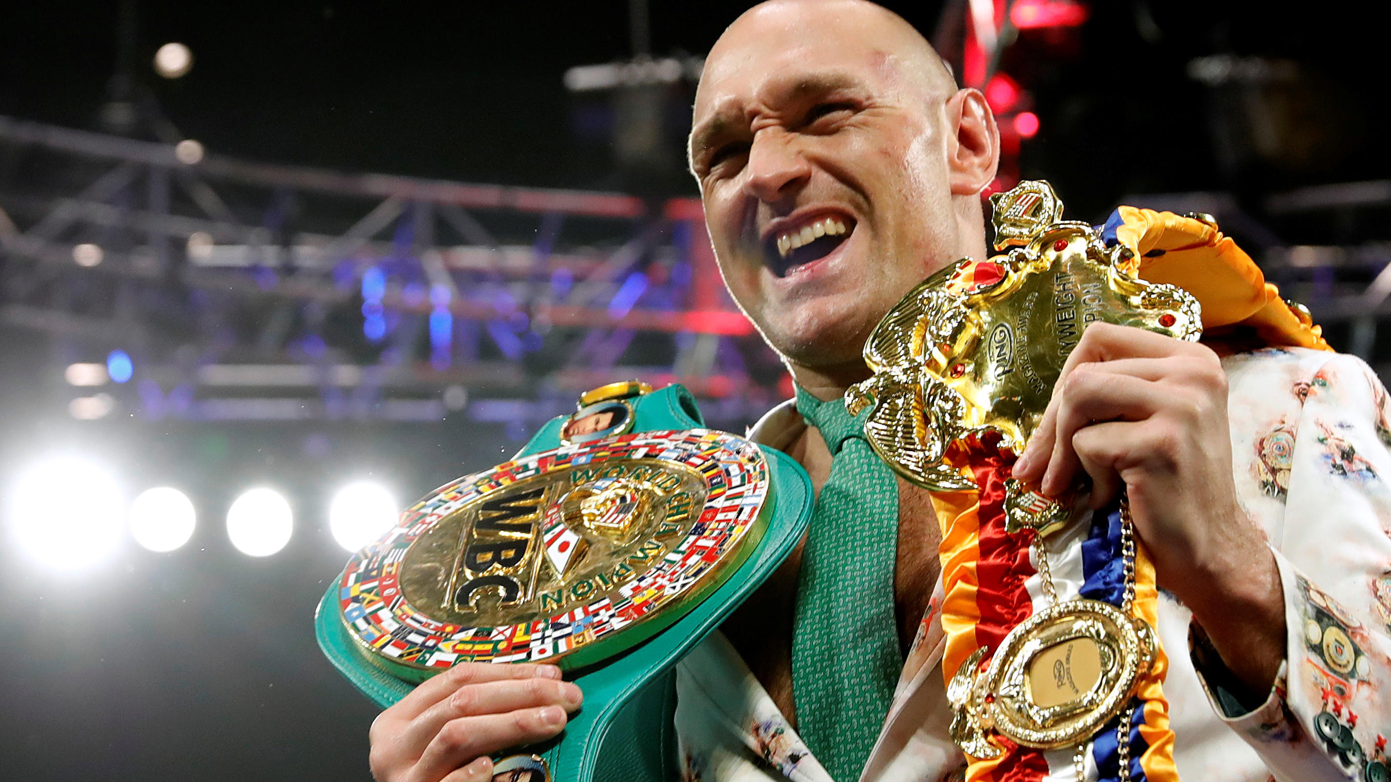 FILE PHOTO: Boxing - Deontay Wilder v Tyson Fury - WBC Heavyweight Title - The Grand Garden Arena at MGM Grand, Las Vegas, United States - February 22, 2020 Tyson Fury poses with his belts during a press conference after the fight REUTERS/Steve Marcu