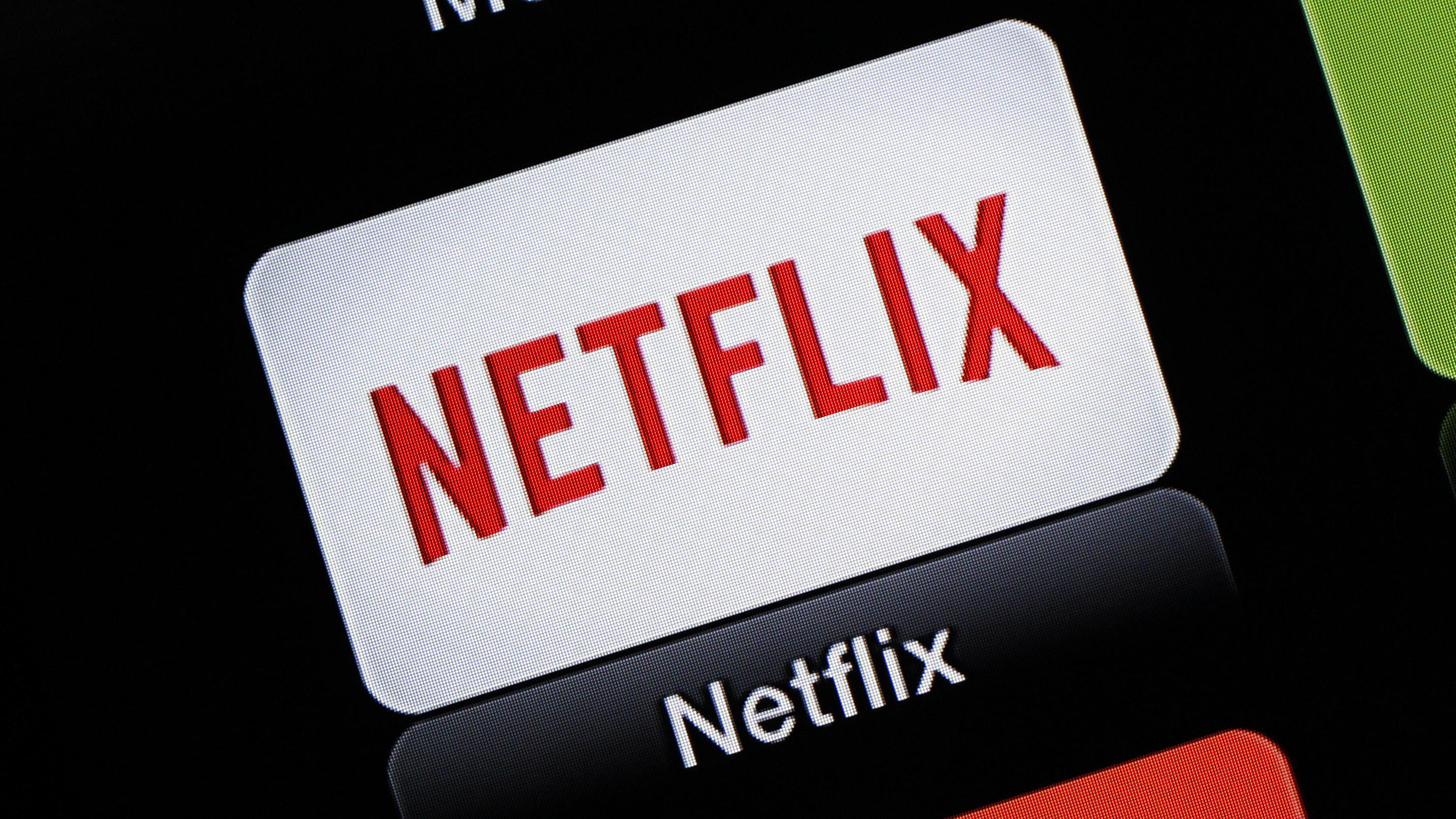 FILE - This June 24, 2015, file photo, shows the Netflix Apple TV app icon, in South Orange, N.J. Netflix reports financial results on Monday, April 18, 2016. Sports are on hold, movie theaters are closed and so are amusement parks. But Americans hel