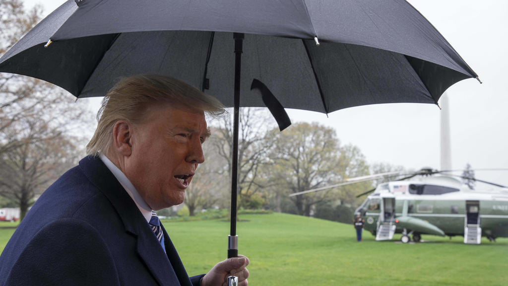 March 28, 2020, Washington, District of Columbia, USA: United States President Donald J. Trump talks to the media before he boards Marine One on the South Lawn of the White House in Washington, D.C., U.S., on Saturday, March 28, 2020. President Dona