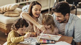 Playful family painting together