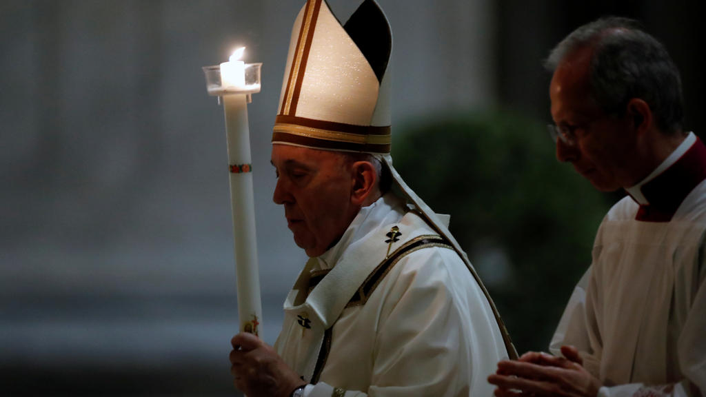 Pope Francis leads the Easter vigil Mass in St. Peter's Basilica with no public participation due to the outbreak of the coronavirus disease (COVID-19) at the Vatican, April 11, 2020. REUTERS/Remo Casilli/Pool