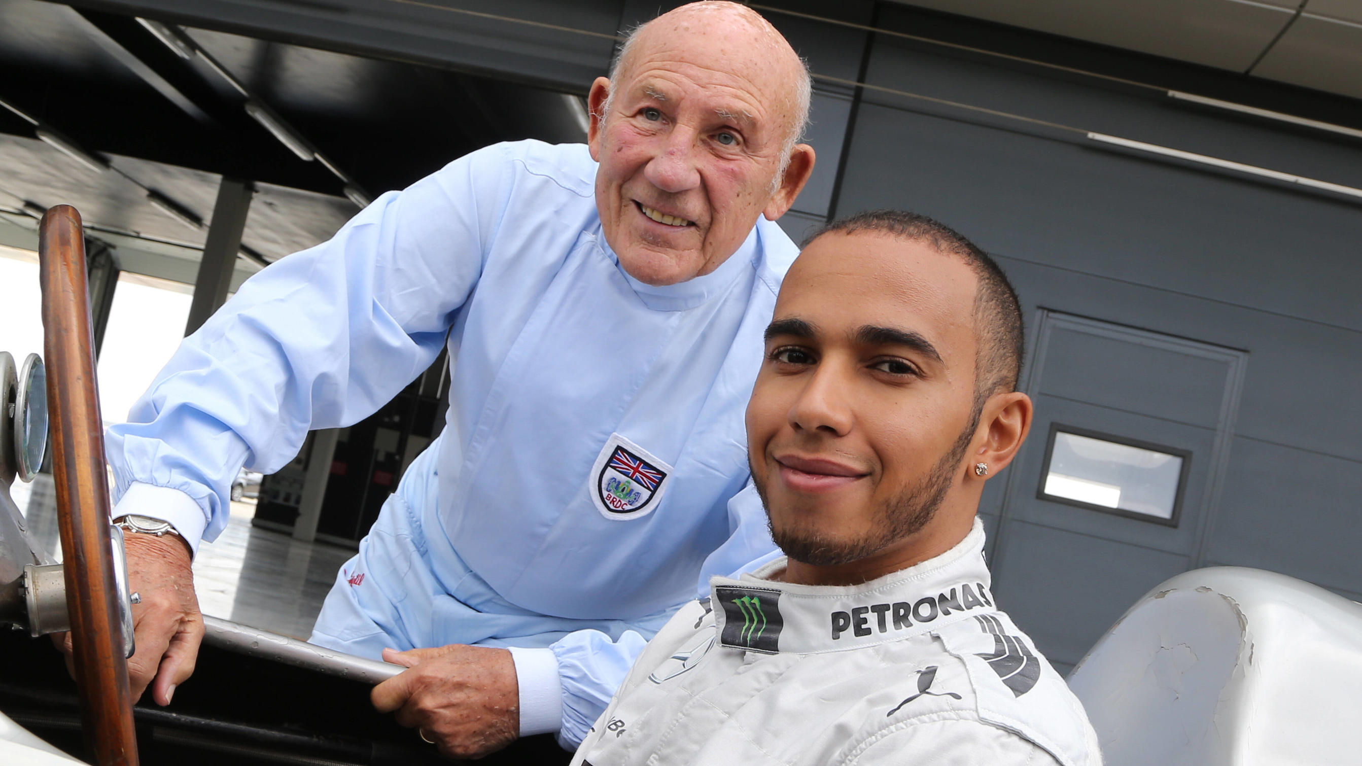  British GP preview with Lewis Hamilton and Sir Stirling Moss, Silverstone, England, 31 May 2013. R to L: Sir Stirling Moss GBR and Lewis Hamilton GBR Mercedes AMG F1 with the double F1 Grand Prix winning Mercedes-Benz W196 at a press event to public