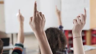  University students raising their hands in classroom, Bavaria, Germany mit201701149