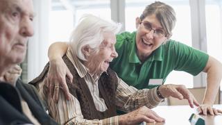  Nurse and senior woman having fun in rest home mit201710577