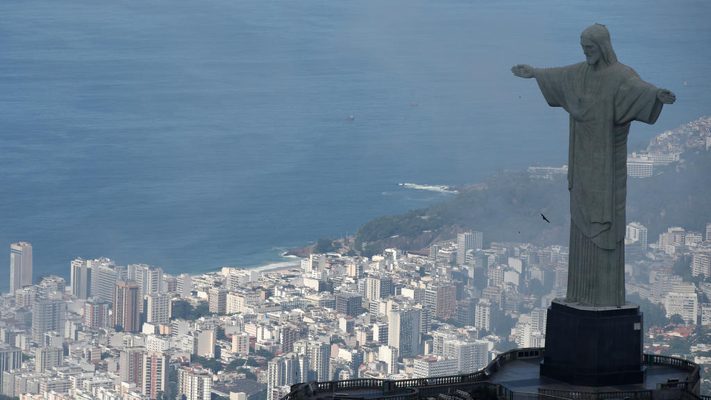 An aerial view shows the Christ the Redeemer statue with the Copacabana beach during the coronavirus disease (COVID-19) outbreak, in Rio de Janeiro, Brazil, March 26, 2020. REUTERS/Ricardo Moraes