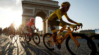 FILE PHOTO: Cycling - Tour de France - The 128-km Stage 21 from Rambouillet to Paris Champs-Elysees - July 28, 2019 - Team INEOS rider Egan Bernal of Colombia, wearing the overall leader's yellow jersey, in action in front of the Arc de Triomphe. REUTERS/Gonzalo Fuentes/File Photo