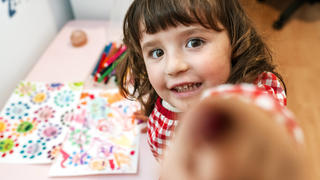  Little girl drawing ugly viruses with color markers at home model released Symbolfoto property released GEMF03506