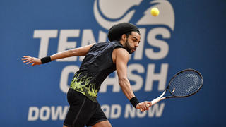 Germany's tennis player Dustin Brown returns the ball during a pro-tennis tournament at a local base tennis academy in Hoehr-Grenzhausen, western Germany, Friday, May 1, 2020. The professional tennis exhibition in the small village in the Westerwald is a rare exception to the global shutdown of sports during the coronavirus pandemic. Matches are played without line judges and without spectators, and broadcasted by remote cameras worldwide. (AP Photo/Martin Meissner)