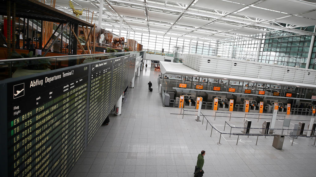 FILE PHOTO: Empty Lufthansa ticket counters are pictured at Munich's international airport, as the spread of the coronavirus disease (COVID-19) continues, in Germany, March 17, 2020. REUTERS/Michael Dalder/File Photo