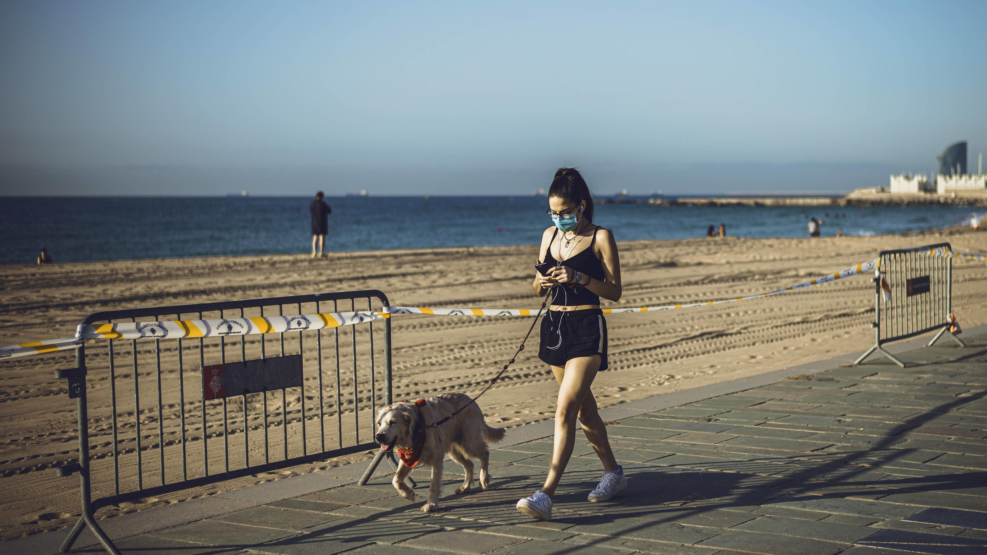 May 8, 2020: A young woman runs with her dog in the early morning as Barcelona s beach re-opens for individual sport exercises during the first phase of a gradual way to the new normal rolling back a nearly seven weeks long nationwide strict lockdown