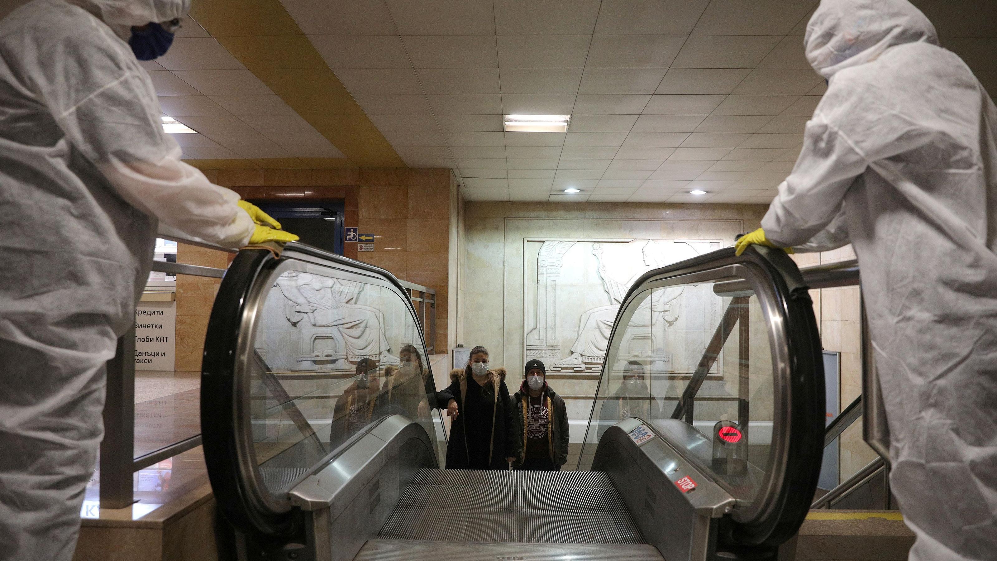 FILE PHOTO: Workers disinfect an escalator in Serdika metro station, following the outbreak of the coronavirus disease (COVID-19), Sofia, Bulgaria, April 8, 2020.  REUTERS/Stoyan Nenov/File Photo