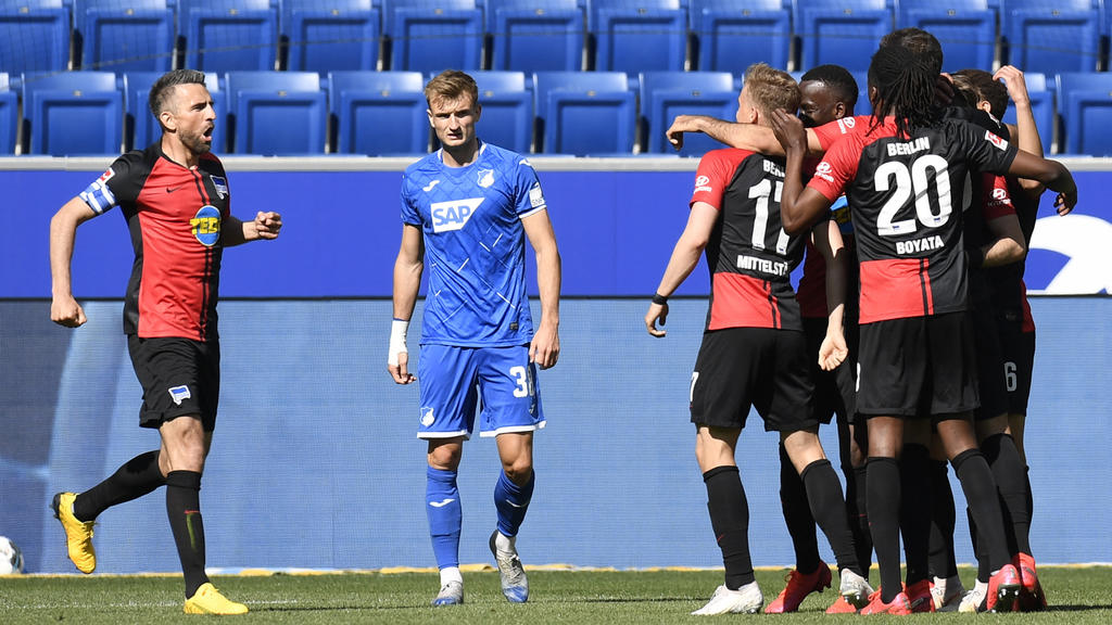 SINSHEIM, GERMANY - MAY 16: Vedad Ibisevic of Hertha BSC celebrates his sides first goal with his team mates as Stefan Posch of TSG 1899 Hoffenheim reacts during the Bundesliga match between TSG 1899 Hoffenheim and Hertha BSC at PreZero-Arena on May