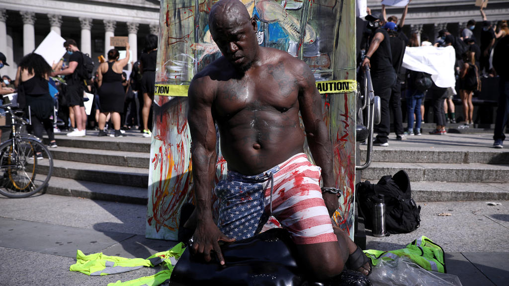 A protester performs during "I can't breathe" vigil and rally against the death in Minneapolis police custody of African-American man George Floyd, in New York, U.S. May 29, 2020. REUTERS/Caitlin Ochs
