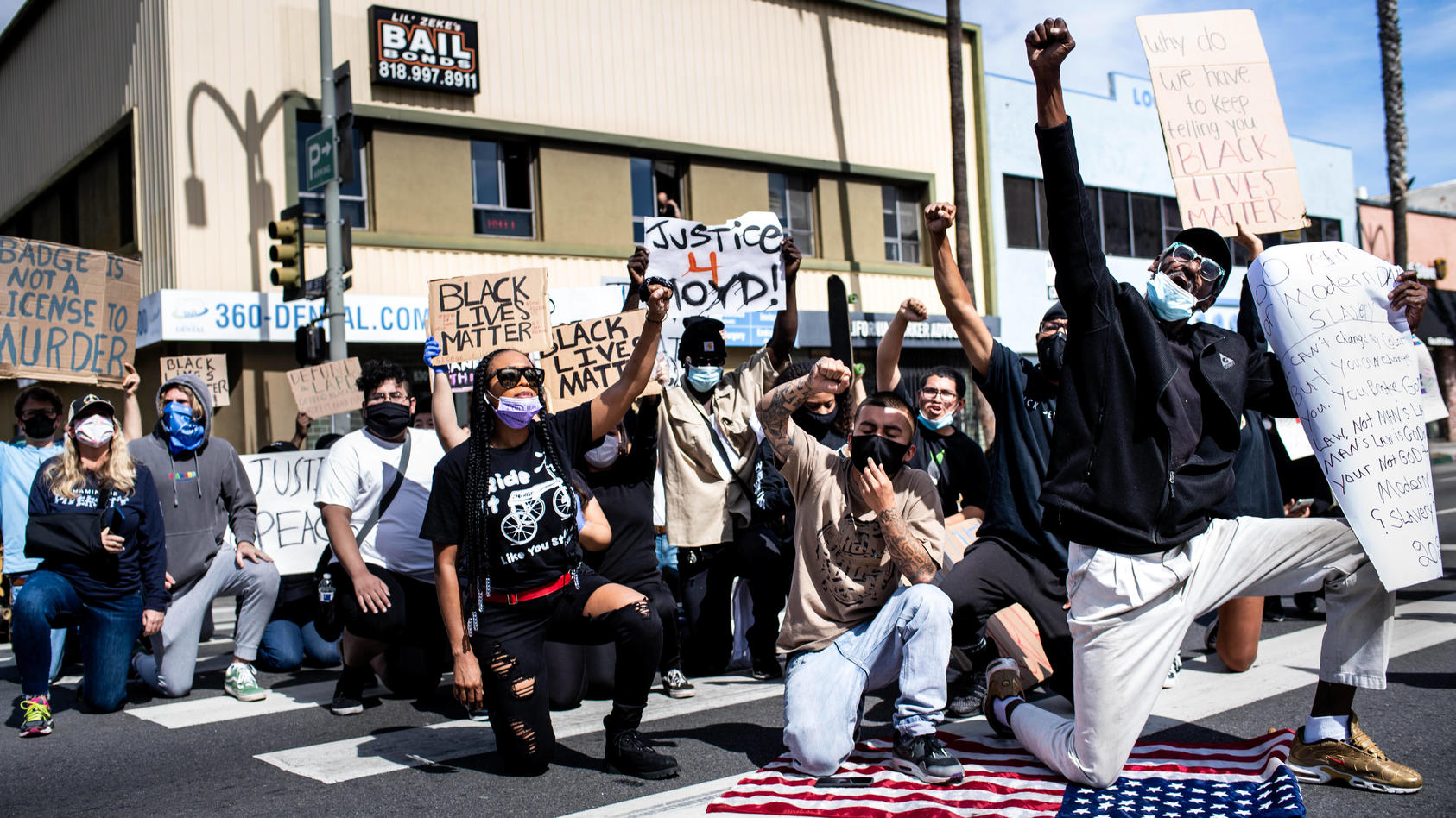 June 1, 2020, Van Nuys, California, USA: Protesters take a knee on Van Nuys Boulevard during a peaceful protest with Bl
