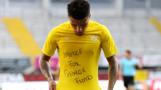 FILE PHOTO: Soccer Football - Bundesliga - SC Paderborn v Borussia Dortmund - Benteler Arena, Paderborn, Germany - May 31, 2020 Borussia Dortmund's Jadon Sancho celebrates scoring their second goal with a 'Justice for George Floyd' shirt, as play resumes behind closed doors following the outbreak of the coronavirus disease (COVID-19) Lars Baron/Pool via REUTERS   DFL regulations prohibit any use of photographs as image sequences and/or quasi-video/File Photo