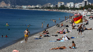 People sunbathe on Konyaalti beach, amid the COVID-19 outbreak, in the southern resort city of Antalya, Turkey June 19, 2020. Picture taken June 19, 2020. REUTERS/Kaan Soyturk