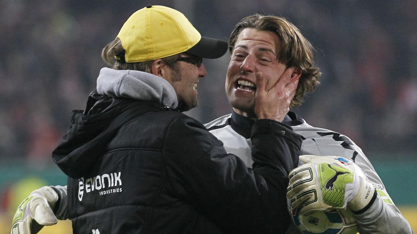 Borussia Dortmund's goal keeper Weidenfeller celebrates together with coach Klopp after beating Fortuna Duesseldorf in a penalty shoot-out in their German soccer cup DFB Pokal match in the western German city of Duesseldorf