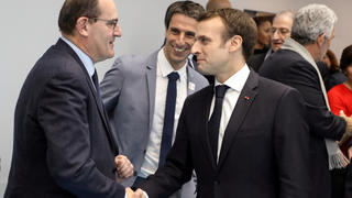 FILE PHOTO: French President Emmanuel Macron shakes hands with Interministerial Delegate for the Olympic and Paralympic Games 2024 Jean Castex (L) flanked by President of the Paris Organising Committee of the 2024 Olympic and Paralympic Games Tony Estanguet during the inauguration of a new handball complex in Creteil, on the outskirts of Paris, France January 9, 2019. Ludovic Marin/Pool via REUTERS/File Photo