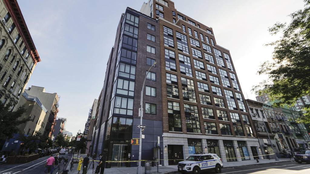 A New York Police cruiser is parked at 265 East Houston Street Wednesday, July 15, 2020, in New York. Police say the dismembered body of a 33-year-old tech entrepreneur has been found inside his luxury Manhattan condo. Fahim Saleh was found at around