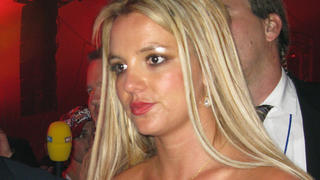 The rumours were flying around the VIP room as Britney Spears showed up at the 50th birthday party for designer Christian Audigier with her agent Jason Trawick, her father Jamie Spears and a friend (plus chauffeur, bodyguard etc). She wore a tight sexy black dress, Louboutin heels and a bright red lipstick. Britney seemed relaxed and happy and laughed as she and Jason shared some jokes. The pair seemed very comfortable together. They sat in a private VIP booth, stayed for 1/2 hour, Britney took a cigarette break and her father seemed to be happy with his daughter having a great time with Jason.