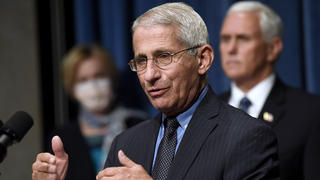 FILE - In this June 26, 2020, file photo Director of the National Institute of Allergy and Infectious Diseases Dr. Anthony Fauci, center, speaks as Vice President Mike Pence, right, and Dr. Deborah Birx, White House coronavirus response coordinator, left, listen during a news conference with members of the Coronavirus task force at the Department of Health and Human Services in Washington. Fauci has warned that the United States could soon see 100,000 infections per day. â€œWe havenâ€™t even begun to see the end of it yet,â€ Fauci said during a talk hosted by Stanford Universityâ€™s School of Medicine. (AP Photo/Susan Walsh, File)