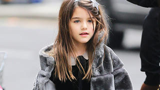 Suri Cruise was spotted heading to a movie theatre with friend and her parents after school in New York City.