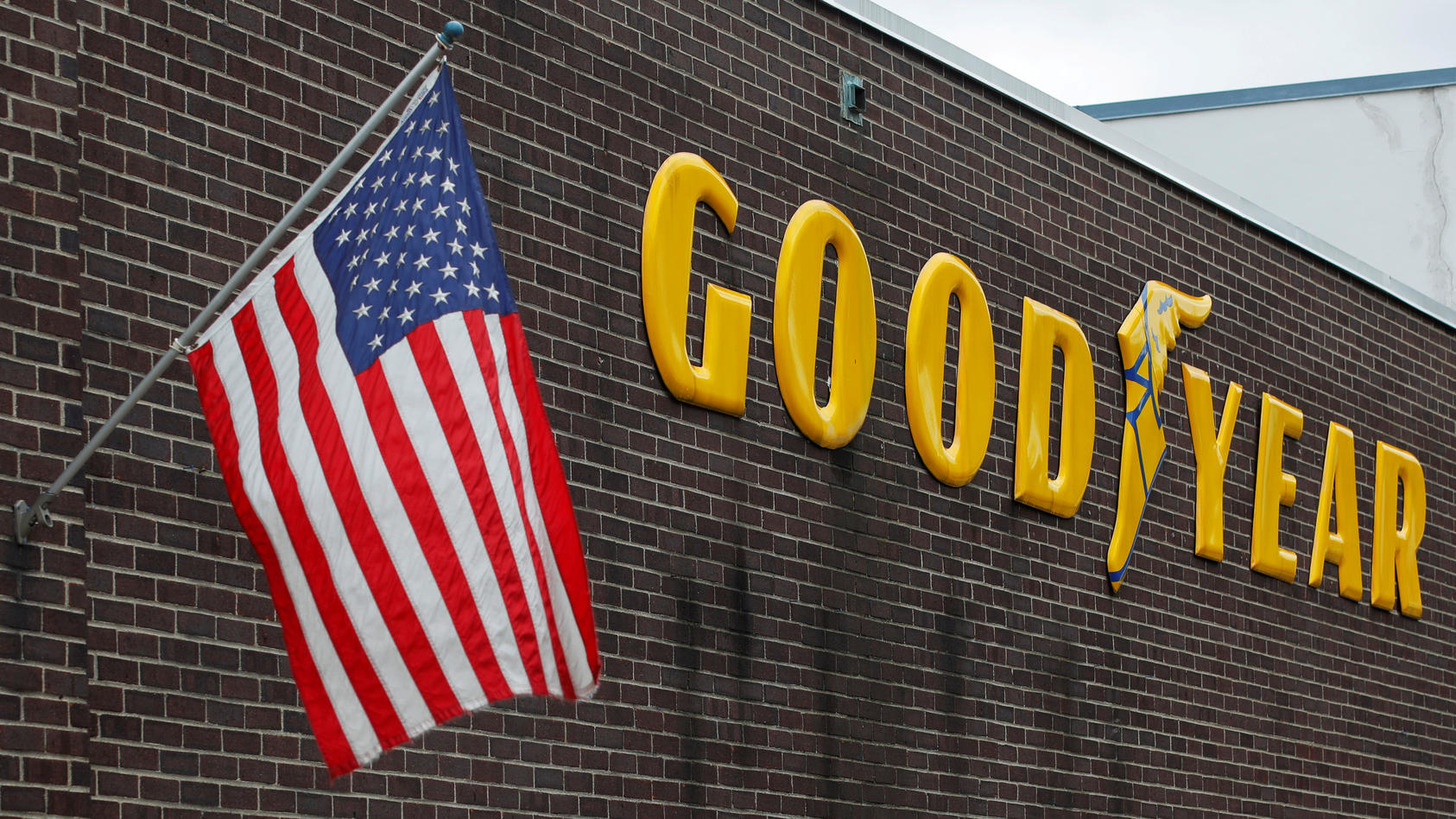 FILE PHOTO: A U.S. flag flies at a Goodyear Tire facility in Somerville, Massachusetts, U.S., July 25, 2017. REUTERS/Brian Snyder/File Photo