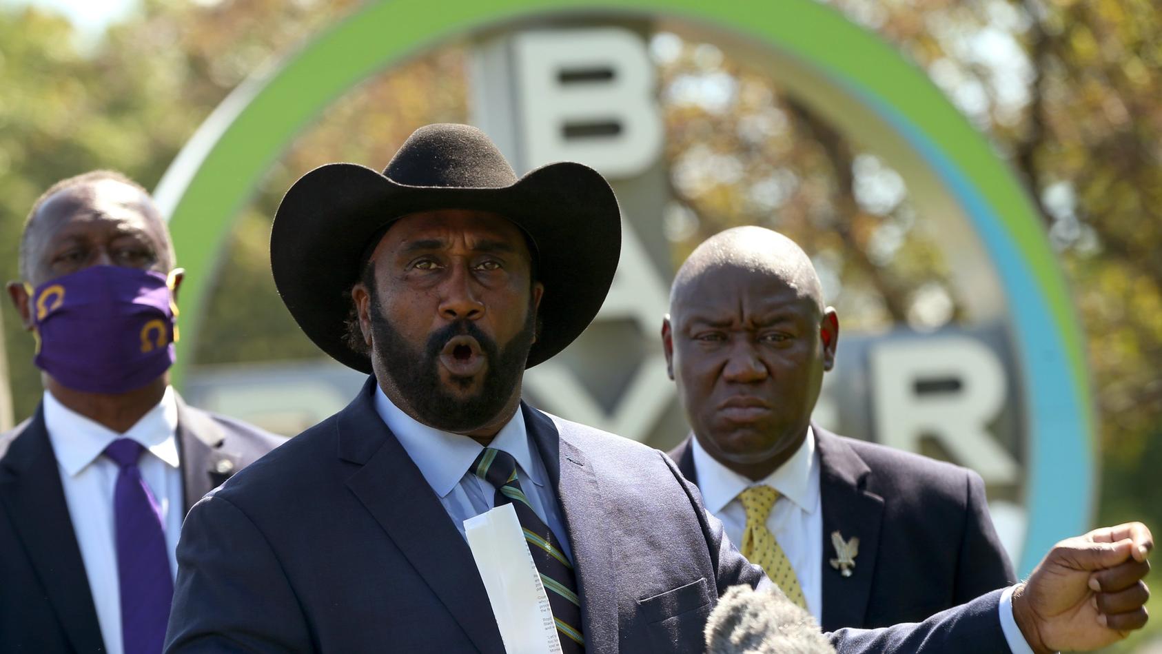 John Wesley Boyd, Jr., center, founder and president of the National Black Farmers' Association, speaks at a press conference on Wednesday, Aug. 26, 2020,in Creve Coeur, Mo., after Attorney Ben Crump, right, announced federal action to block Bayer-Mo