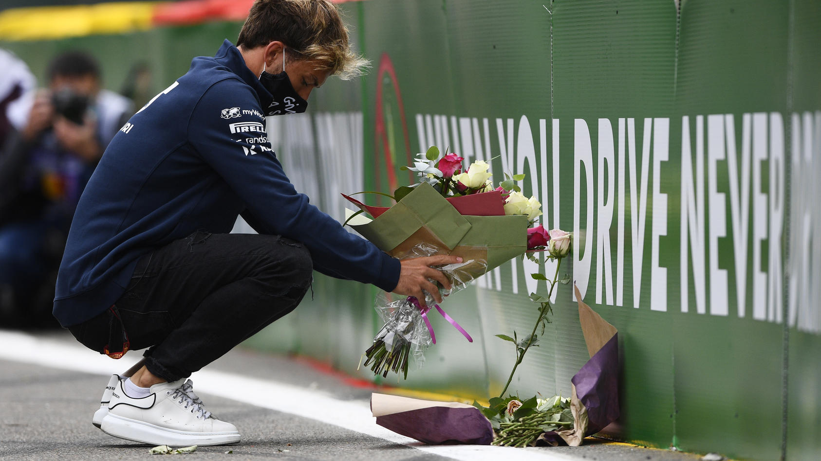SPA, BELGIUM - AUGUST 27: Pierre Gasly of France and Scuderia AlphaTauri leaves flowers at the side of the track in tribute to the late Formula 2 driver Anthoine Hubert, who passed at this race in 2019 during previews ahead of the F1 Grand Prix of Be