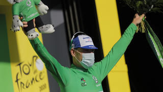 Cycling - Tour de France - Stage 10 - Ile d'Oleron to Ile de Re - France - September 8, 2020. Deceuninck-Quick Step rider Sam Bennett of Ireland, wearing the green jersey, celebrates on the podium. Pool via REUTERS/Christophe Ena