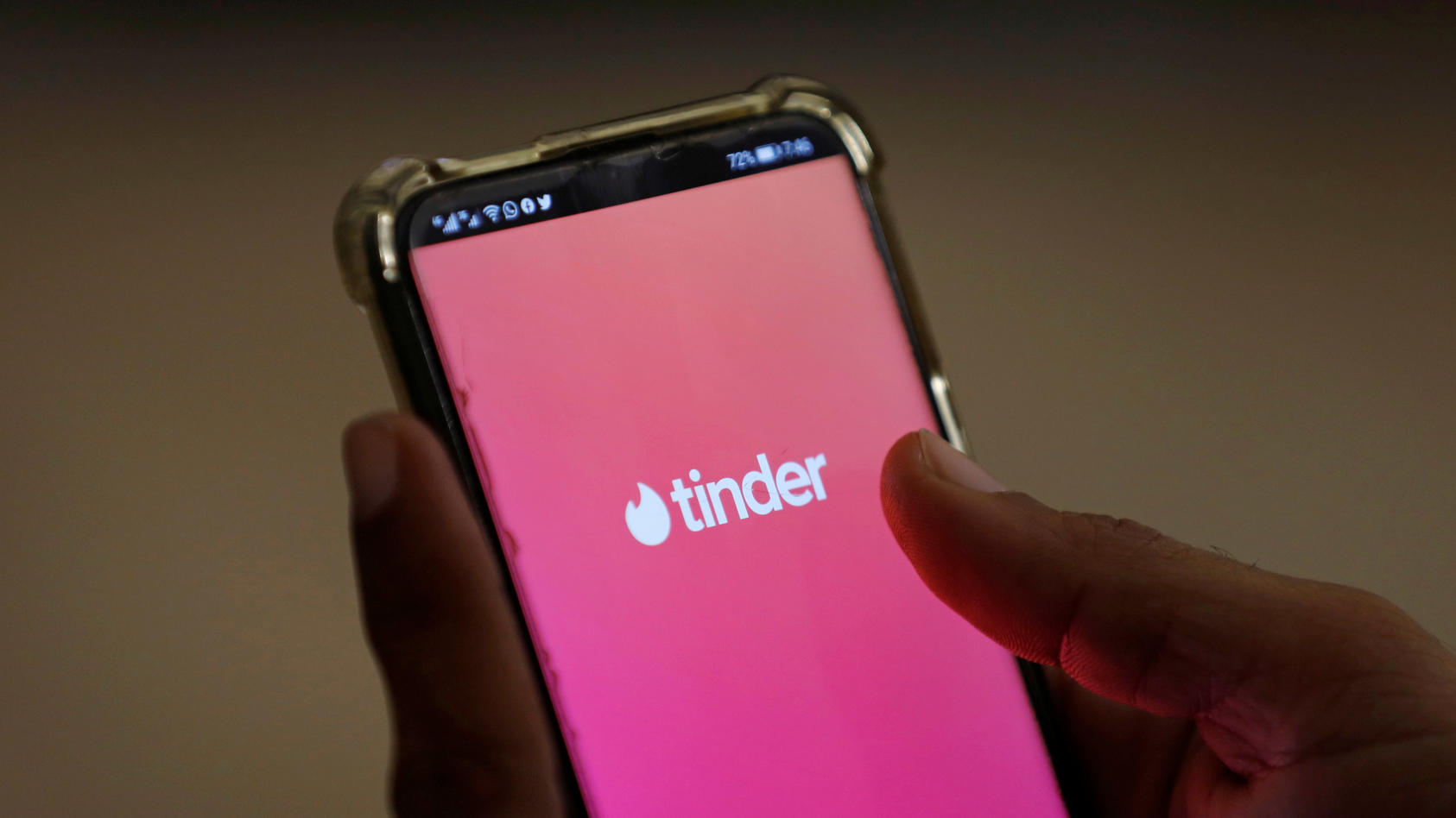 The dating app Tinder is shown on a mobile phone in this picture illustration