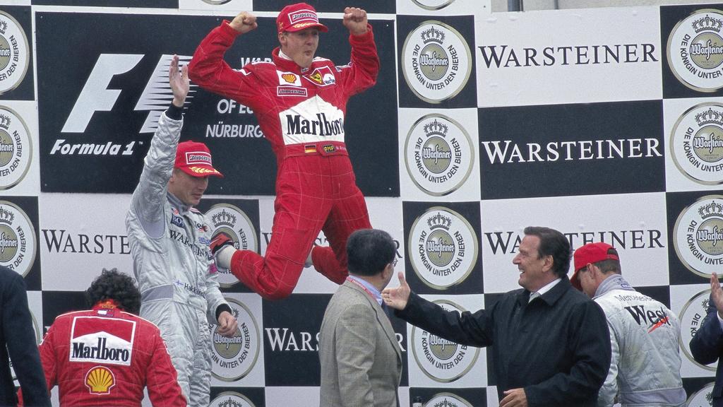 Lob vom Kanzler - Gerhard Schröder gratuliert Michael Schumacher zu dessen Regen-Triumph beim Europa-GP2000