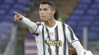 Juventus' Cristiano Ronaldo, right, celebrates after scoring his side's second goal during the Italian Serie A soccer match between Roma and Juventus at Rome's Olympic stadium, Sunday, Sept. 27, 2020. (AP Photo/Gregorio Borgia)