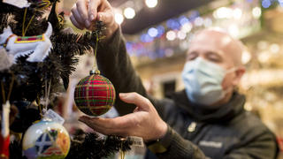 Chris Smyth owner of Ye Olde Christmas Shoppe in Edinburgh hangs a decoration on a Christmas tree in his shop, as Mr Leitch said people should "get their digital Christmas ready" due to the continued covid-19 outbreak., Credit:Euan Cherry / Avalon (in process) / Avalon |