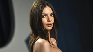 FILE - Model Emily Ratajkowski arrives at the Vanity Fair Oscar Party in Beverly Hills, Calif., on Feb. 9, 2020. The British model and activist has a book deal. She is working on an essay collection called â€œMy Body.â€ Metropolitan Books will publish it in 2022. (Photo by Evan Agostini/Invision/AP, File)