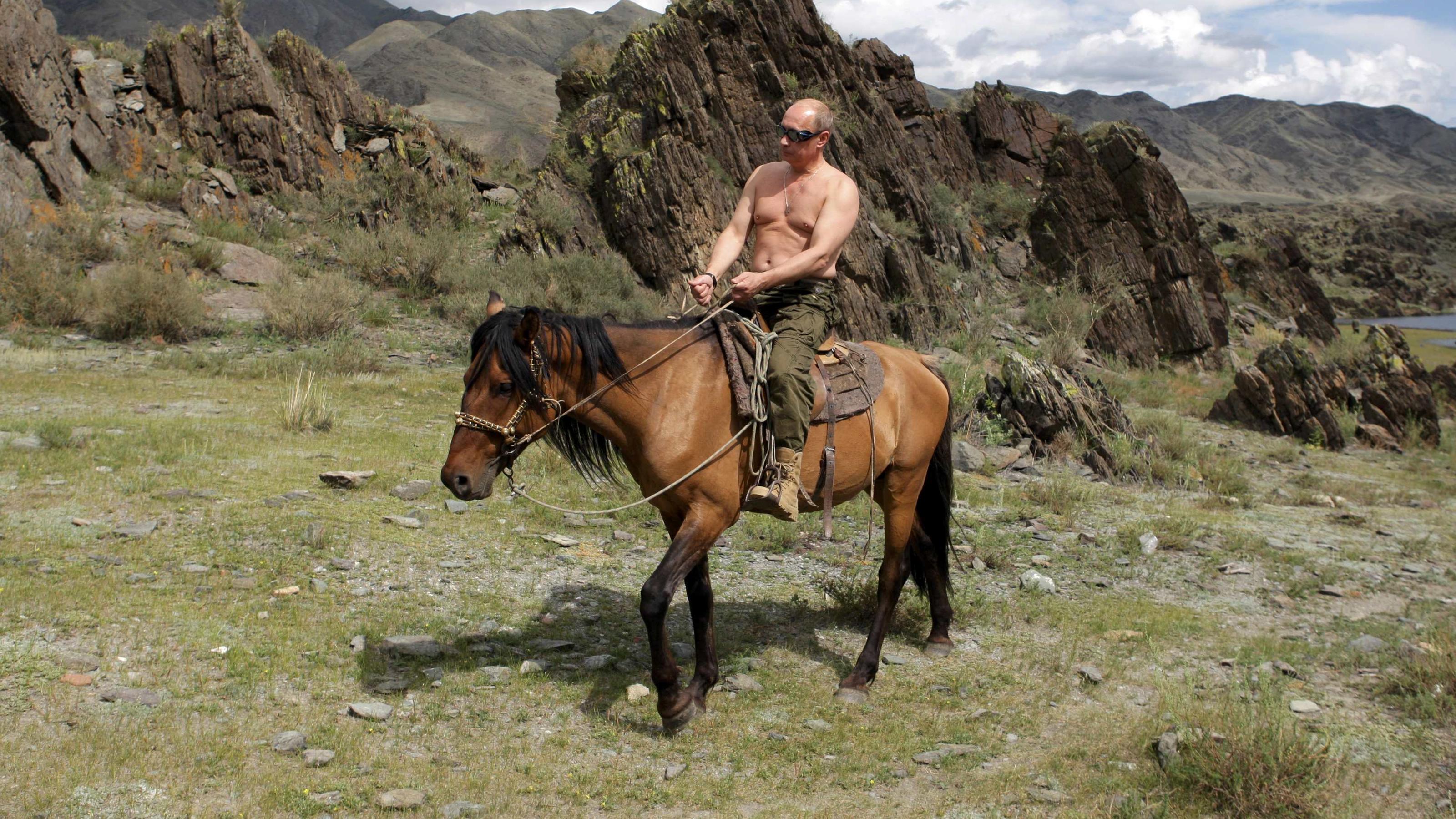 Russia's Prime Minister Vladimir Putin rides a horse in southern Siberia's Tuva region in this August 3, 2009 file photo. Russians will go to the polls on March 4, 2012, to choose one of five candidates to be their new president. Picture taken August